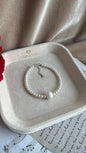 White Fresh water 2-2.5mm pearl bracelet with 9-10mm centre pearl, silver 925 parts