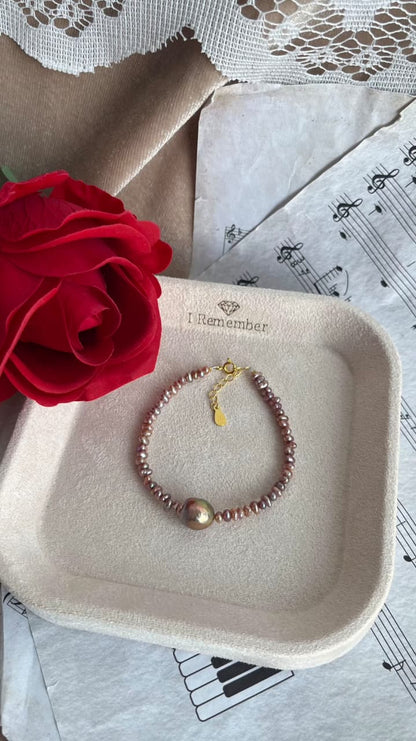 Purple Fresh water 2-2.5mm pearl bracelet with 9-10mm centre pearl, silver 925 golden plated parts