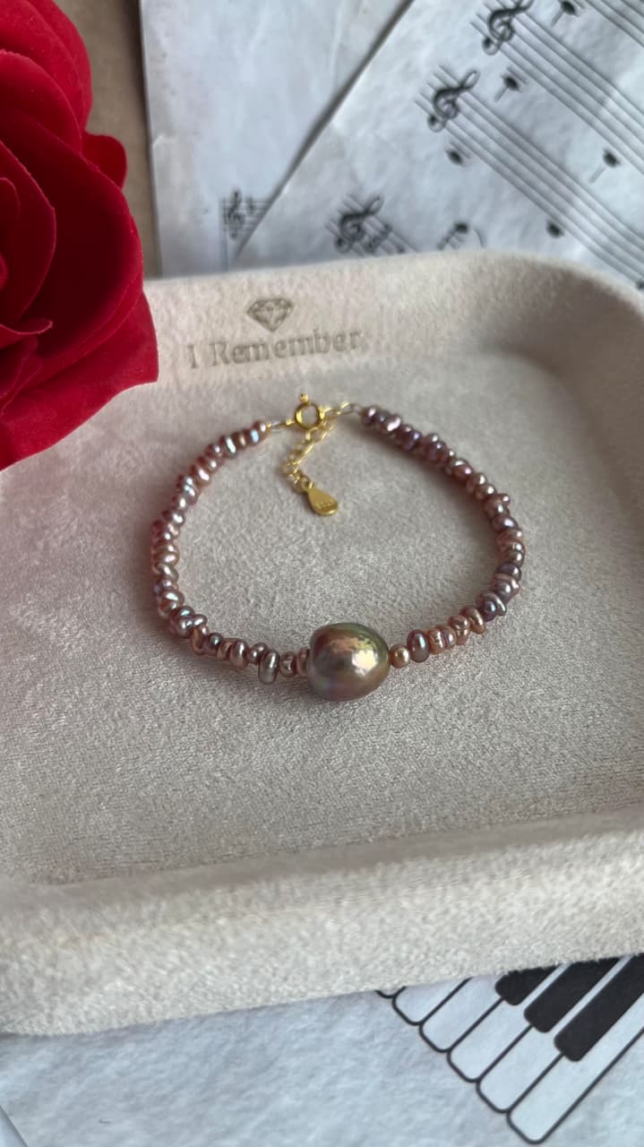 Purple Fresh water 2-2.5mm pearl bracelet with 9-10mm centre pearl, silver 925 golden plated parts
